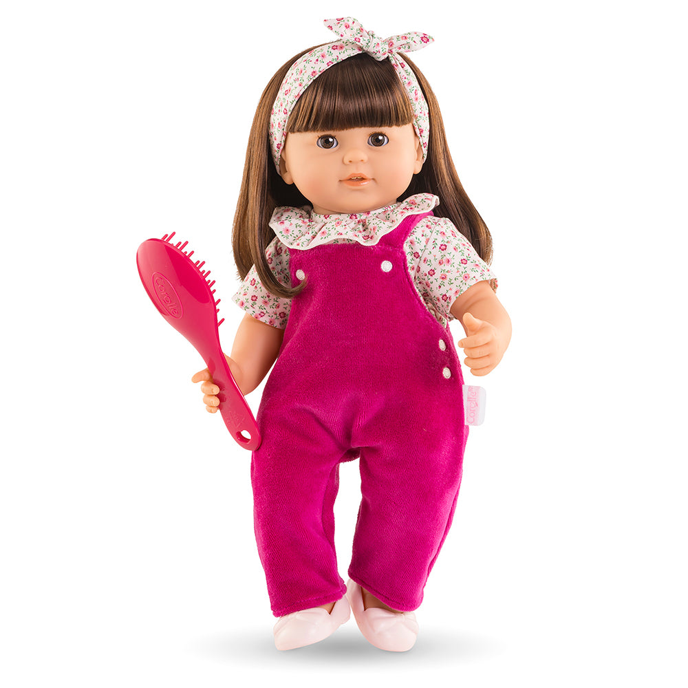 Poupon à coiffer Julie avec longs cheveux et brosse, tenue rose grenadine, idéal pour les apprentis coiffeurs.