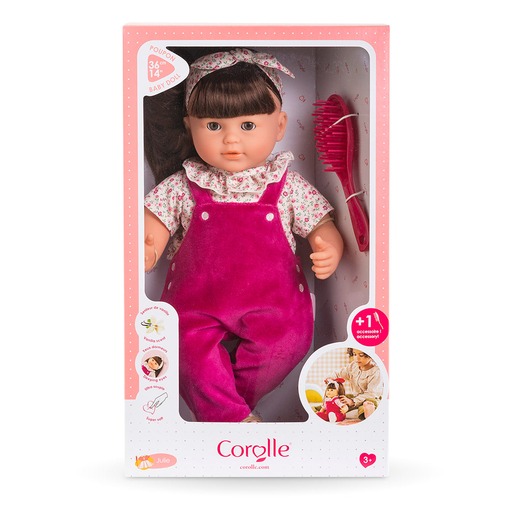 Poupon à coiffer Julie dans sa boîte avec brosse, vêtue d'une salopette rose, par Corolle.