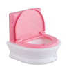 Toilettes interactives poupon en plastique rose et blanc pour jeux d'imitation de propreté.