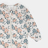 Dormeuse bébé imprimé fleurs avec motif floral printanier sur fond clair.