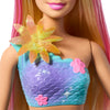 Barbie sirène magique fleurie blonde avec un haut décoré de fleurs et une étoile brillante.