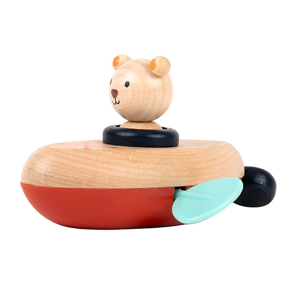 jouet aquatique ourson canoë en bois avec un ourson sur un canoë rouge et bleu.