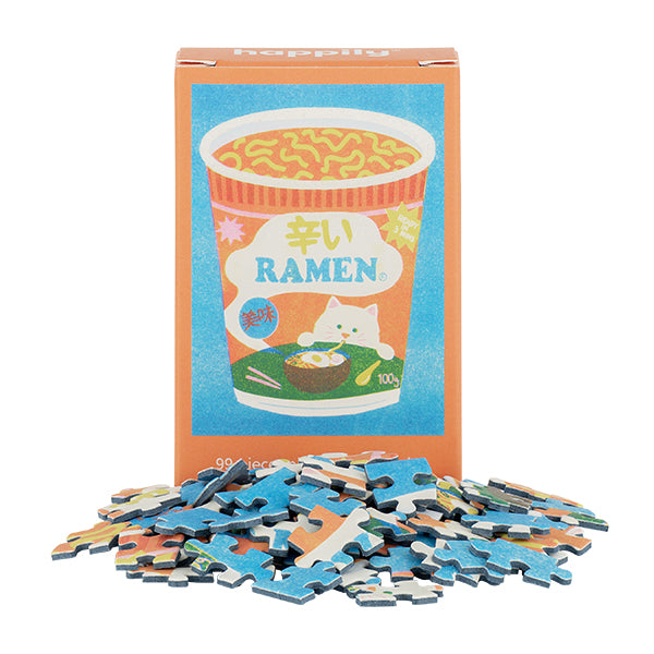 mini puzzle ramen 99 pièces avec un emballage coloré et des pièces de puzzle éparpillées.