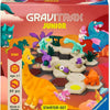 GraviTrax Junior dinosaure starter set avec dinosaures colorés et pièces de construction ludiques pour enfants.