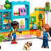 LEGO Friends dépanneur Heartlake City avec deux personnages, un caddie et un chien à l'intérieur d'un magasin coloré.