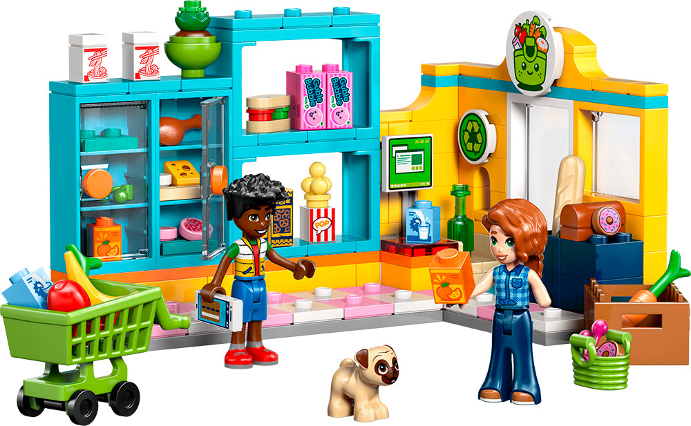 LEGO Friends dépanneur Heartlake City avec deux personnages, un caddie et un chien à l'intérieur d'un magasin coloré.