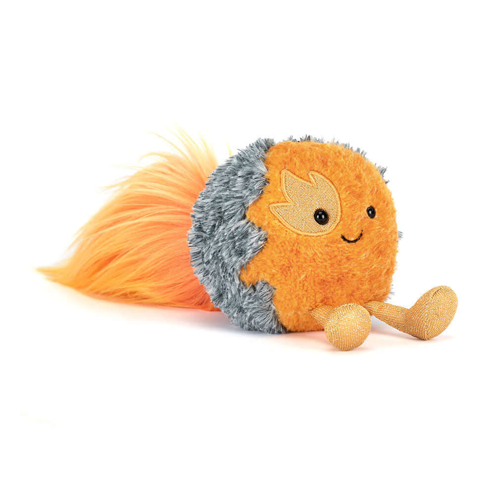 Jellycat Space Comet peluche couleur orange avec une queue en fourrure et un visage souriant.