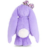 Peluche lapin doux floral, arrière du lapin violet avec longues oreilles et un nœud à motifs floraux sur la tête.