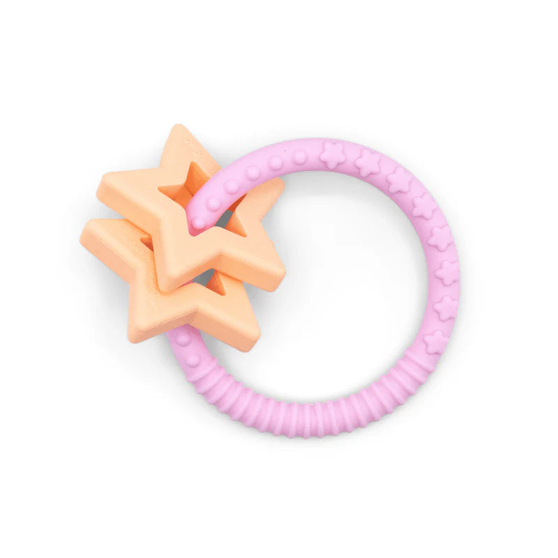 Anneau de dentition silicone rose avec étoiles en silicone pour apaiser les gencives des bébés.